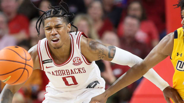 Razorbacks' Khalif Battle starts to go for a loose ball against UNC-Greensboro on Friday night